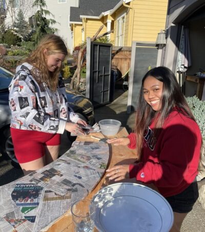 Lily and Sarah paper maché the moon